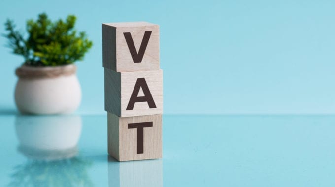 VAT Deferral Scheme Indicated On Wooden Blocks Reading VAT