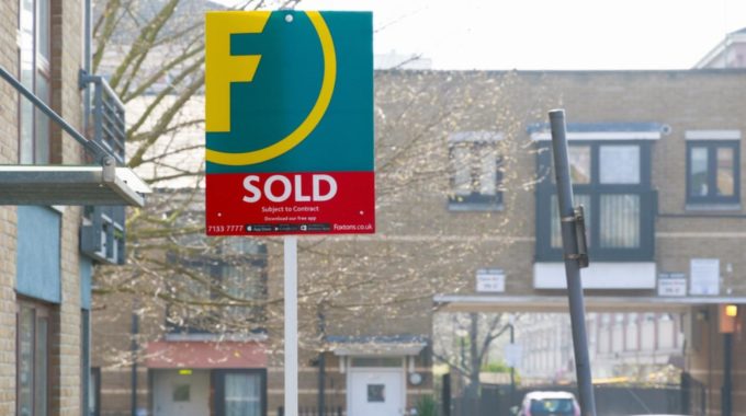 A For Sale Board Outside A House Indicating Capital Gains Tax On Sale Of Property