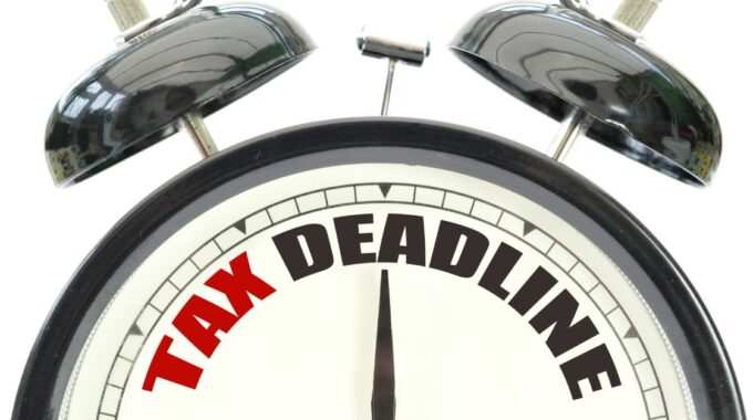 Self-assessment Tax Deadline Written On Alarm Clock